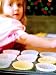 Kids in the kitchen and they are cooking tea