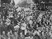 American Military Personnel Posted in Paris Holding Newspapers with Headlines Reading...