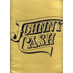 JOHNNY CASH Photo Souvenir Photo Book with photographs by Johnny Cash, June Carter Cash, John Carter Cash, Chance Martin, Alexander Agor, and Marian Ward (GOLD COVER 12 x 9 inches, 24 pages Lyrics of Man In Black and Ragged Old Flag on vellum paper., Features full-color photos of Johnny Cash, June Carter Cash, their family and friends.)