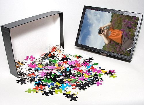 Photo Jigsaw Puzzle of Young boy looking through binoculars on heath Norfolk summer from David Tipling