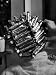 Woman at Beauty Salon in curlers and tinfoil for permanent waves hairstyle in late 30...
