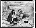 [Two Apache Indian women at campfire, cooking pot in front of one] Reprint (15 x 12 inches)
