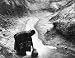 1915 photo Indian woman getting water from stream in Southwestern United States. Nature's art work