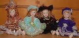 SET OF 4 MINI PORCELAIN DOLLS