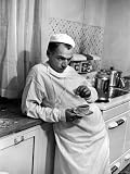 Dr. Ernest Ceriani in a State of Exhaustion, Having a Cup of Coffee in the Hospital Kitchen at 2 AM Photographic Poster Print by W. Eugene Smith, 30x40