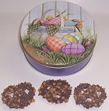 Scott's Cakes 1 lb. Milk Chocolate Covered Pretzel with Chocolate Chips & Peanut Butter Chips in a Easter Basket Tin