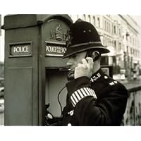 Photographic Prints of Policeman at a police call box from Mary Evans