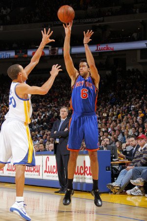 New York Knicks v Golden State Warriors: Danilo Gallinari and Stephen Curry Photographic Poster Print by Rocky Widner, 8x12