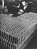 51BLyuVS9bL. SL160  Rows of 15 cm Shells on Table Where Worker Uses Hammer and Stamping Tool at Skoda Munitions Factory Artists Photographic Poster Print by Margaret Bourke White, 12x16