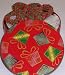 Scott's Cakes 1 lb. Dark Chocolate Covered Pretzel with Christmas Jimmies in a Christmas Present Tin