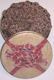 Scott's Cakes Mini Chocolate Covered Pretzels with Christmas Color Non-Pareils in a Red Bow Tin