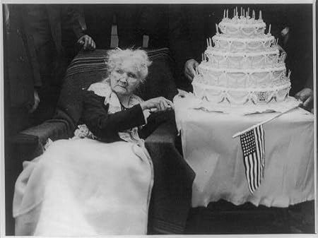 Mary Harris Mother Jones,1837-1930, cuts her birthday cake