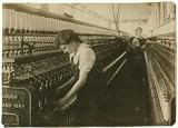 Photo King Philip Mill - Card Room. Doffer on Jack Speeder. Bertha Bonneau, 15 years, 105 Slade St. Location: Fall
