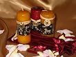 A Set of Three Scented Candles in a Satin Gift Bag