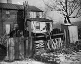 1938 photo Capital slums to go under new low rent housing program. Washington, D.C., Nov. 30. Now th