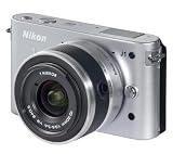 NIKON 1 J1 – silver + 10-30 mm Lens + SDHC 16 GB Class 10 Flash memory card + EN-EL20 Li-Ion Battery + SLM-C200 semi-rigid protective case – black . Picture