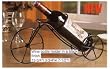 Six pcs wine bottle holder in a black finish.