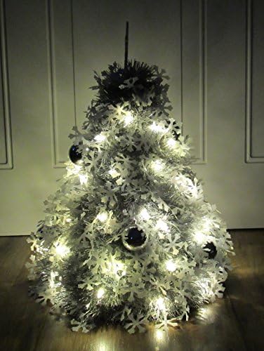 Pre-lit Silver and White Snowflake Table Top Christmas Tree Decorated with Shatterproof Ornaments, Sparkly White Snowflake Tree Topper, and White Lights.