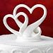 Sleek interlocking hearts design cake topper