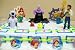 Adorable Disney Little Mermaid 15 Piece Birthday Cake Topper Featuring Ariel, Prince Eric, Max The Sheep Dog, Ursula, King Triton, Sebastian, Flounder, 6 Little Mermaid Themed Buttons, Decorative Sand Castle and Decorative Ship Wheel