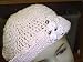 Ht3, Hand Crocheted Baby Pink Gimp Floppy Hat with Three White Carnations