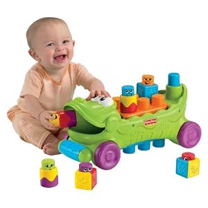 Fisher-Price Stack ‘n Surprise Blocks Musical Croc Block Wagon by Fisher-Price