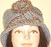 Hand Crocheted Teal Color Acrylic Wool Winter Hat Trimmed with Light Brown and Crocheted Rosette