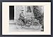 Framed Prints of Man on an early motorcycle in front of a house from Mary Evans