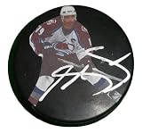 Joe Sakic Autographed Colorado Avalanche Photo Hockey Puck, Proof Photo of Joe Signing for Us.