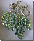 Silver Bow Pin With Green Crystals B1R33