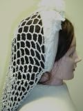 S822, Hand Crocheted Vintage White Gimp Large Snood Mounted on Lace Trimmed Flexible Headband. Body of the Snood Trimmed with Floral Patches.