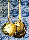 Brass Strainers Hanging on a Tile Wall - 36