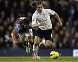Photographic Prints of Luka Modric gets away from the challenge of Stilyian Petrov from Tottenham Hotspur