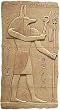 Anubis Standing with Crook and Flail Egyptian Relief, Stone