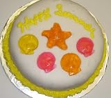 Carrot Decorated Cake Single Layer 8 RoundTopped with Mixed Fruit Sea Shell and Starfish Gummies