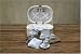 Classic toy tea set in charming white wicker basket with French pattern.
