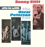 Sits in with the Oscar Peterson Trio