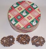 Scott's Cakes 1 lb. Milk Chocolate Covered Pretzel with Chocolate Chips & Peanut Butter Chips in a Snowman Tin