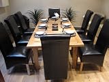 Solid Oak Extending Dining Table and Eight Black Leather Chairs
