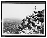 Historic Print (S): [Man looking out from rocky cliff side in a
northwest national park(?)]