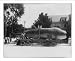 Historic Print (L): [45 ft long shark (whale?) on trailer; 2 children on its back