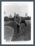 Historic Print (M): [Man swinging at golf ball up hill, Washington, D.C.]