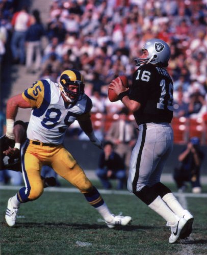 JACK YOUNGBLOOD LOS ANGELES RAMS & JIM PLUNKETT OAKLAND RAIDERS 8X10 SPORTS ACTION PHOTO (A)