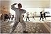 Photographic Print of A group perform Tai chi near the Kowloon waterfront from AWL Discover Images