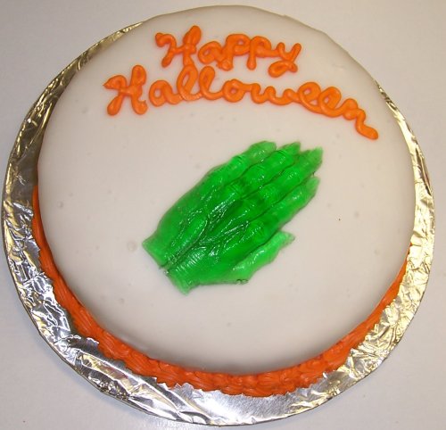 Raspberry Decorated Cake Single Layer 8 Round Topped with Gummie Witch Hand Orange Trim by Scott's Cakes
