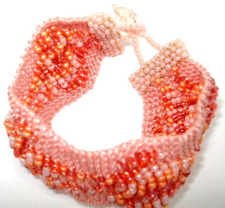 Click here to buy Crochet Crystal Beaded Wavy Bracelet Coral Stretch Bracelet Counts the Sand - Fair Trade.