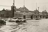 Cars (Old-Fashioned Veihicles Driving Through Flooded Street) Art Poster Print - 11" X 17" Cars (Old-Fashioned Veihicles Driving Through Flooded Street) Art Poster Print - 11" X 17"