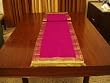 Pink Sari tablerunner with golden trim / tassels