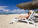 Woman on a Lounger, Princess Cays, Eleuthera Island, West Indies, Caribbean Photographic Poster Print by Richard Cummins, 9x12
