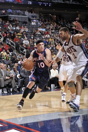 Atlanta Hawks v New Jersey Nets: Mike Bibby and Brook Lopez Photographic Poster Print by David Dow, 12x18